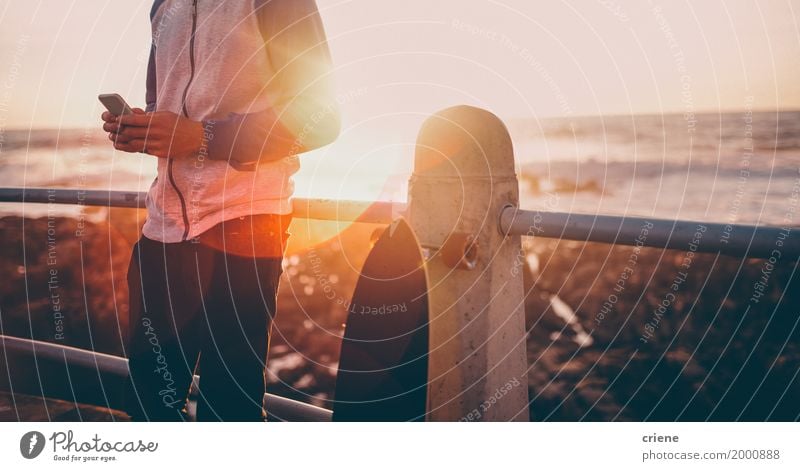 Close-up of man using smart phone on promenade Lifestyle Leisure and hobbies Vacation & Travel Tourism Adventure Summer Summer vacation Sun Beach Ocean