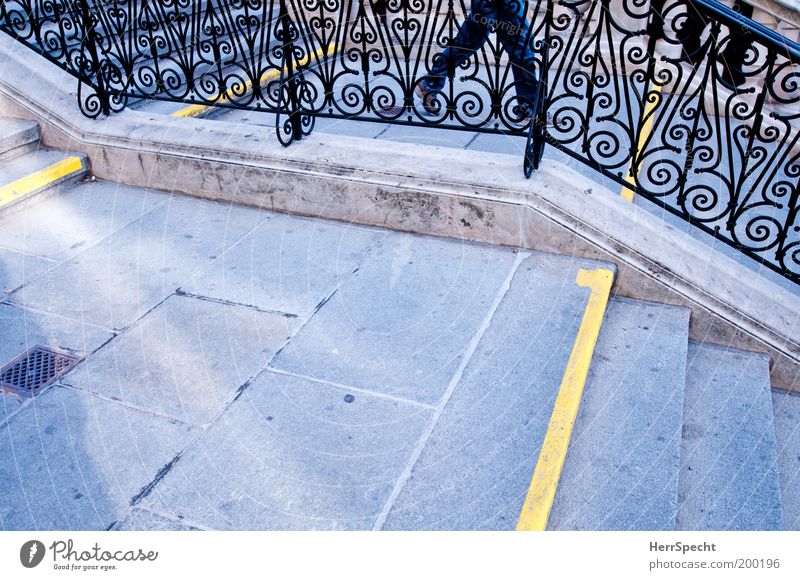 Between the lines Masculine Legs Stairs Banister Landing Newel Line Yellow Gray Downward Wrought iron Grating Colour photo Subdued colour Exterior shot Close-up