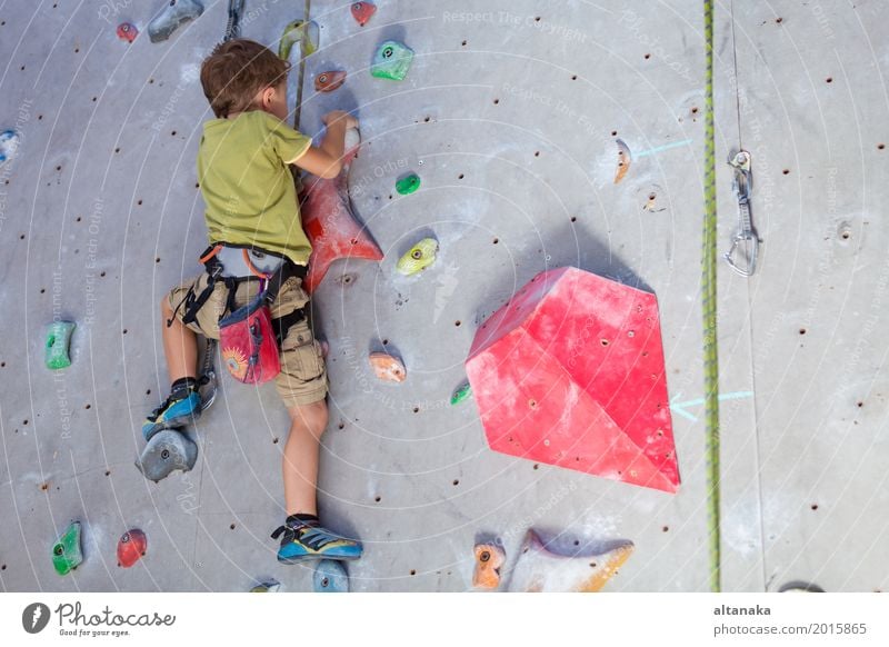 little boy climbing a rock wall indoor Joy Leisure and hobbies Playing Vacation & Travel Adventure Entertainment Sports Climbing Mountaineering Child Rope