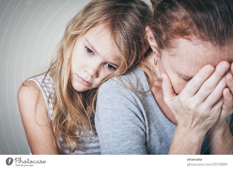 sad daughter hugging his mother at home. Concept of couple family is in sorrow. Lifestyle Face Child Human being Girl Woman Adults Parents Mother