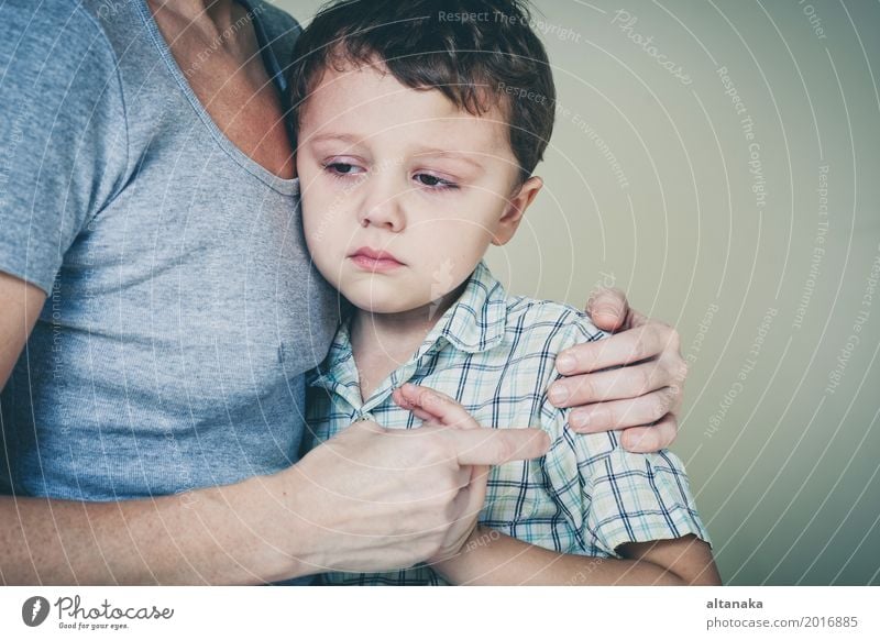 sad son hugging his mother at home. Concept of couple family is in sorrow. Lifestyle Face Child Human being Boy (child) Woman Adults Parents Mother