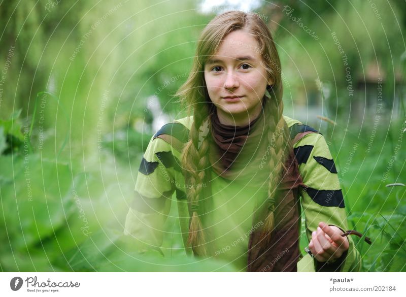 Robin Hood has a sister. Feminine Head Hair and hairstyles Face 1 Human being Nature Plant Grass Bushes Brunette Long-haired Braids Observe To enjoy Wait