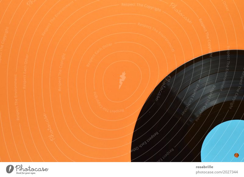 my old records - part of an old black vinyl record on orange background with blank turquoise label Entertainment Party Music Disc jockey Feasts & Celebrations