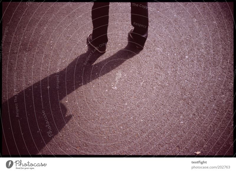 stand Masculine Legs Stand Wait Asphalt Young man Copy Space right Insecure Colour photo Exterior shot Lomography Light Shadow Contrast Copy Space bottom