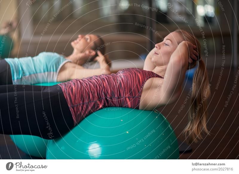 Two women exercising with balls in gym Lifestyle Beautiful Face Sports Woman Adults 2 Human being 18 - 30 years Youth (Young adults) 30 - 45 years Blonde