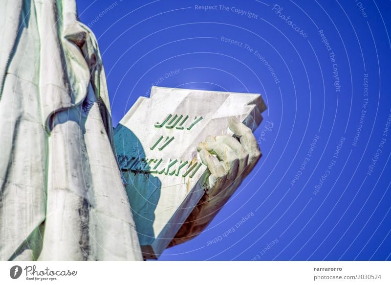 Detail from the Statue of Liberty, New York Tourism Sightseeing Hand Fingers Book Earth Sky Places Landmark Monument Bright Blue Independence 4 Against america