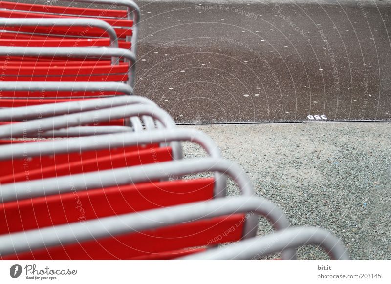 parked in the rain Deserted Gray Red Orderliness Cleanliness Sadness Loneliness Beer garden Chair Backrest Folding chair Gastronomy Restaurant Tidy up Calm