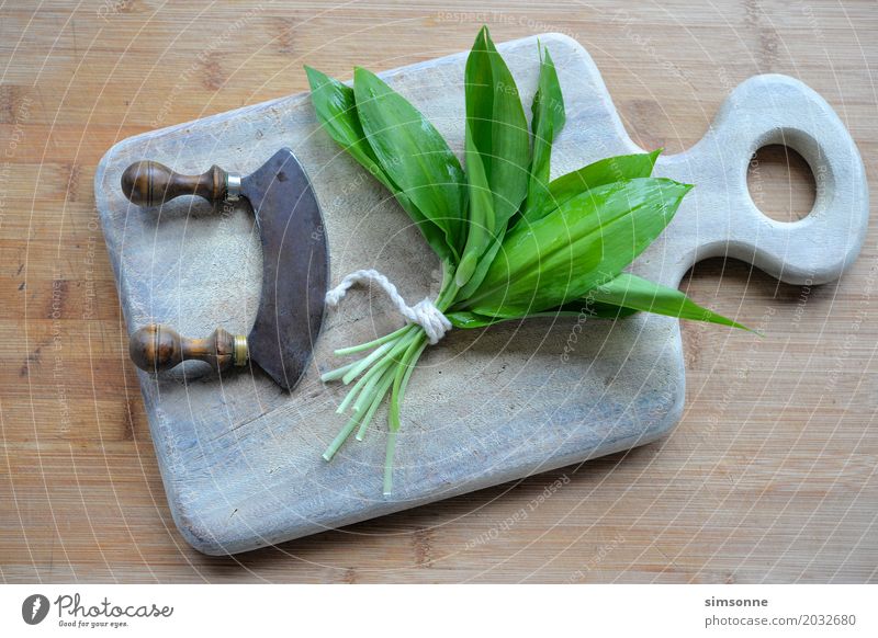 fresh wild garlic in the kitchen Herbs and spices Spring Leaf Fresh Green Club moss Kitchen Italien pesto Eating wild garlic pesto Knives cut wild garlic leaves