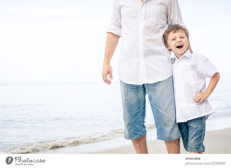 Father and son playing on the beach Lifestyle Joy Relaxation Leisure and hobbies Playing Vacation & Travel Trip Freedom Summer Sun Beach Ocean Child School