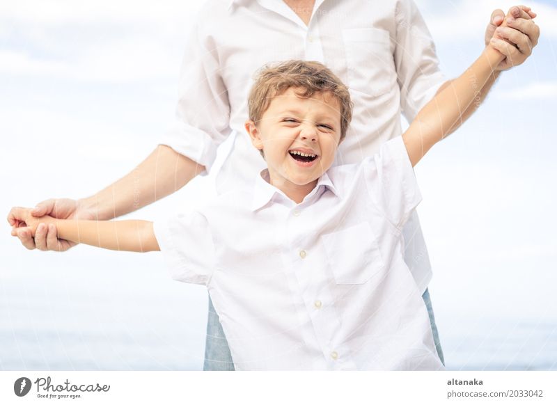 Father and son playing on the beach Lifestyle Joy Relaxation Leisure and hobbies Playing Vacation & Travel Trip Freedom Summer Sun Beach Ocean Child School