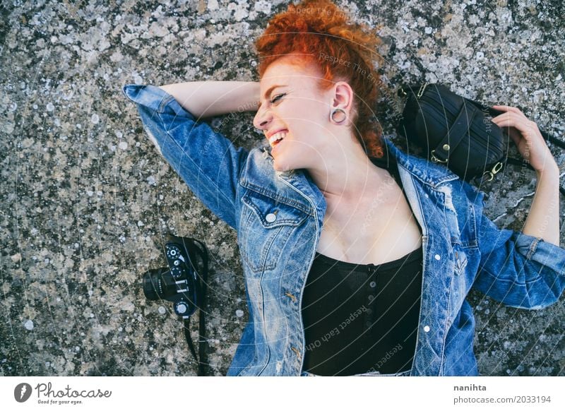 Young redhead woman lying on floor with her bag and her camera Lifestyle Elegant Style Well-being Photography Vacation & Travel Tourism Freedom Feminine