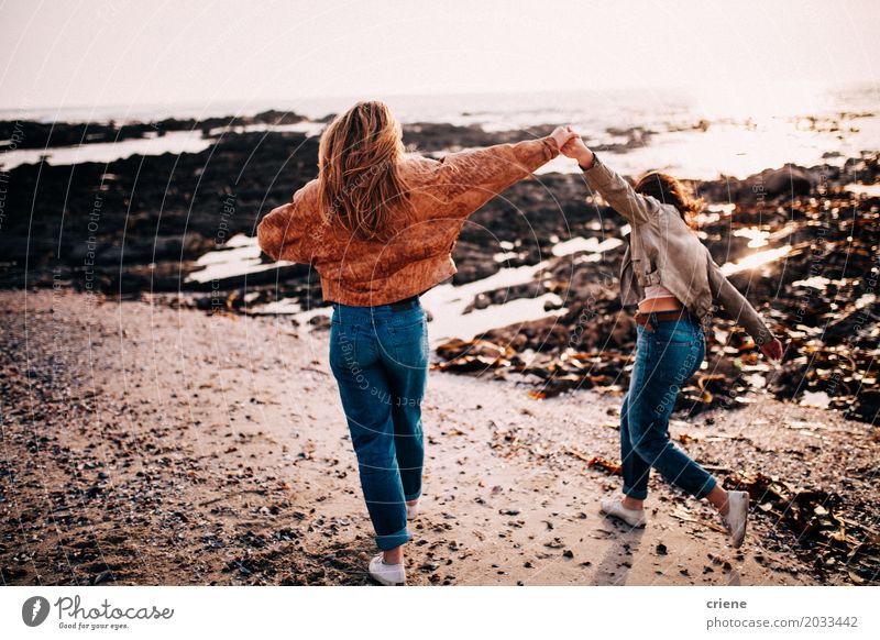 Teenager Girls having fun taking walk on the beach Lifestyle Joy Happy Relaxation Vacation & Travel Tourism Trip Adventure Freedom Beach Ocean Feminine