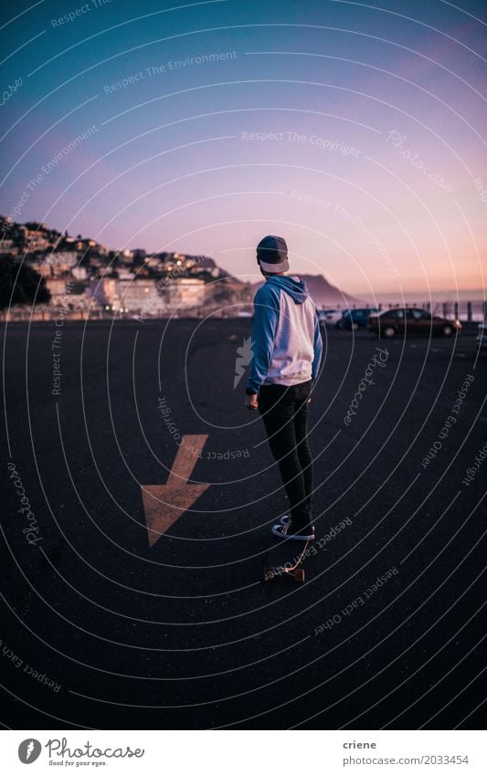 Young man riding with his long board on parking lot Lifestyle Summer Mountain Sports Masculine Youth (Young adults) Man Adults 18 - 30 years Transport Fitness