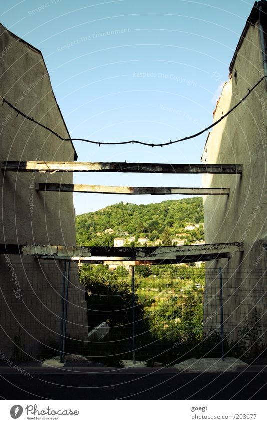 up and away Village Outskirts House (Residential Structure) Manmade structures Wall (barrier) Wall (building) Facade Old Blue Gray Green Joist Cable Prop Fence