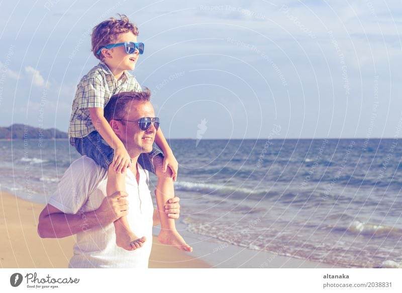 Father and son playing on the beach at the day time. Lifestyle Joy Relaxation Leisure and hobbies Playing Vacation & Travel Trip Adventure Freedom Summer Sun