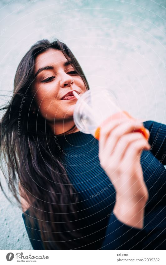 Young caucasian woman enjoying fresh juice Fruit Orange Nutrition Organic produce Vegetarian diet Diet Fasting Beverage Drinking Cold drink Juice Mug Straw