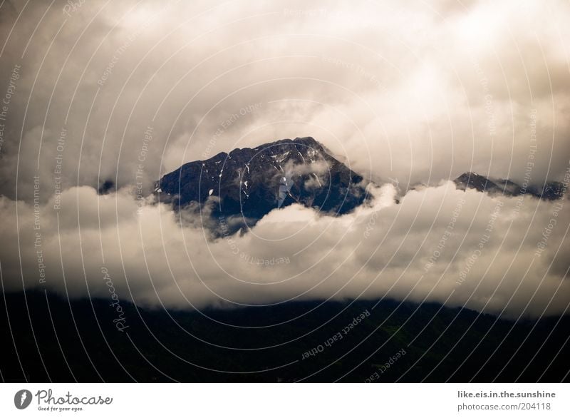 majestic. Far-off places Mountain Clouds Bad weather Fog Rain Rock Alps Peak Fog bank High fog Band of cloud Majestic Copy Space left Copy Space top