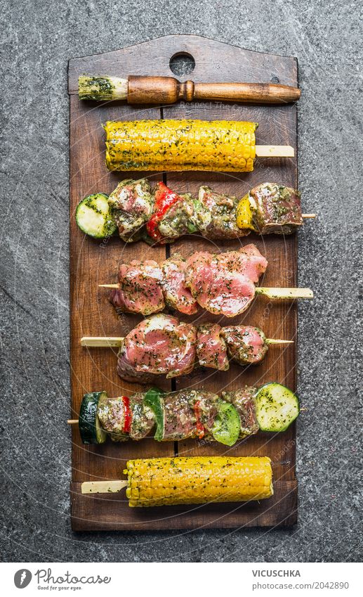 Various meat skewers with vegetables and corn on the cob Food Meat Vegetable Herbs and spices Lunch Banquet Picnic Organic produce Style Design Table Kitchen