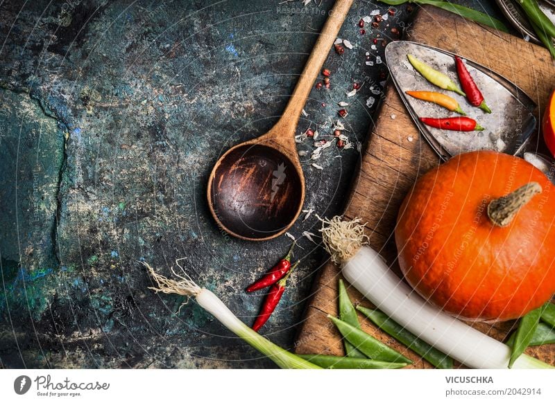 Pumpkin on kitchen table with ingredients and cooking spoon Food Vegetable Herbs and spices Nutrition Banquet Organic produce Vegetarian diet Diet Crockery