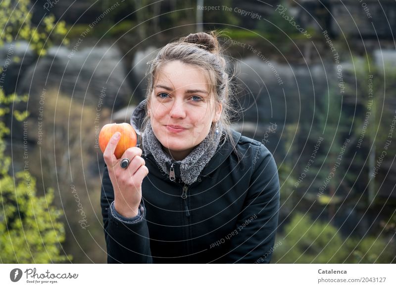 An apple a day ... Young woman eating an apple with relish Healthy Hiking Feminine Youth (Young adults) 1 Human being 18 - 30 years Adults Landscape Plant