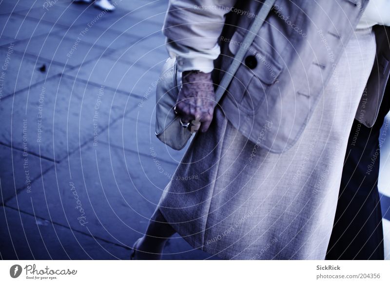 ..behind you Female senior Woman Hand Blue Handbag Subdued colour Exterior shot Copy Space left