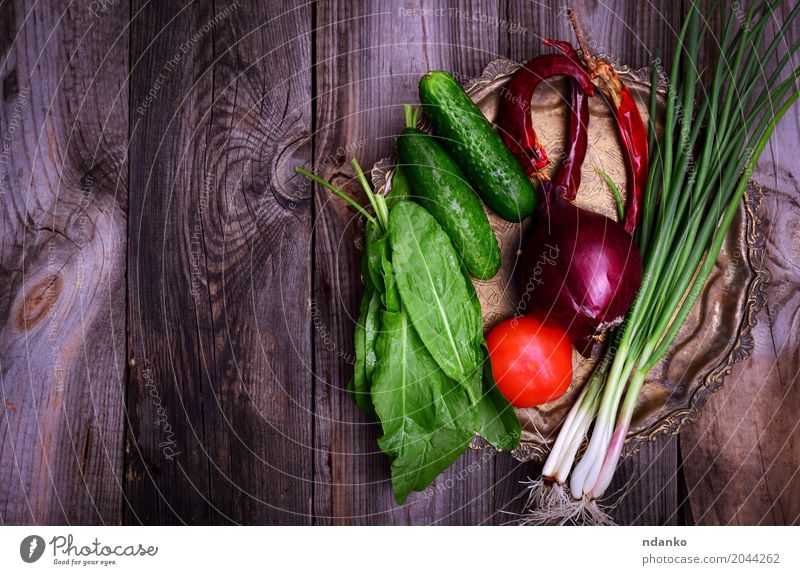 Fresh vegetables on an iron copper plate Food Vegetable Nutrition Vegetarian diet Diet Plate Table Kitchen Eating Natural Above Gray Green Red Tomato cucumber