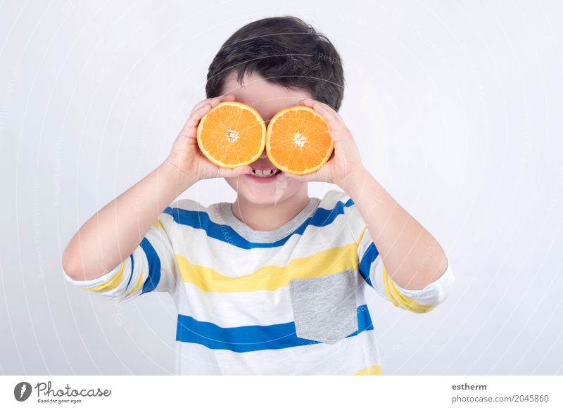 Funny boy with oranges Food Fruit Orange Nutrition Diet Lifestyle Joy Human being Child Toddler Boy (child) Infancy 1 3 - 8 years Feeding Smiling Laughter Fresh