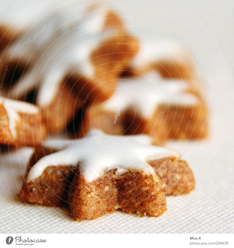 out of season Food Dough Baked goods Candy Nutrition Delicious Sweet Sticky Cinnamon Star cinnamon biscuit Icing Sugar Cookie Colour photo Interior shot