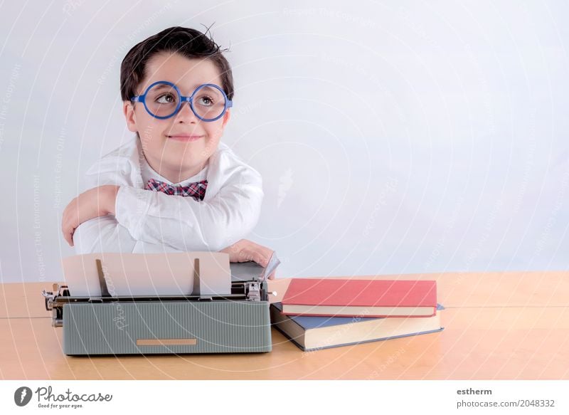 Smiling boy with typewriter Lifestyle Parenting Education Kindergarten Child School Study Schoolchild Student Printing machine Human being Toddler Boy (child)