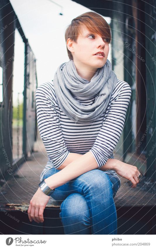 7 Feminine Young woman Youth (Young adults) 1 Human being 18 - 30 years Adults Railroad T-shirt Jeans Ring Rag Bangle Brunette Short-haired Bangs Sit Beautiful