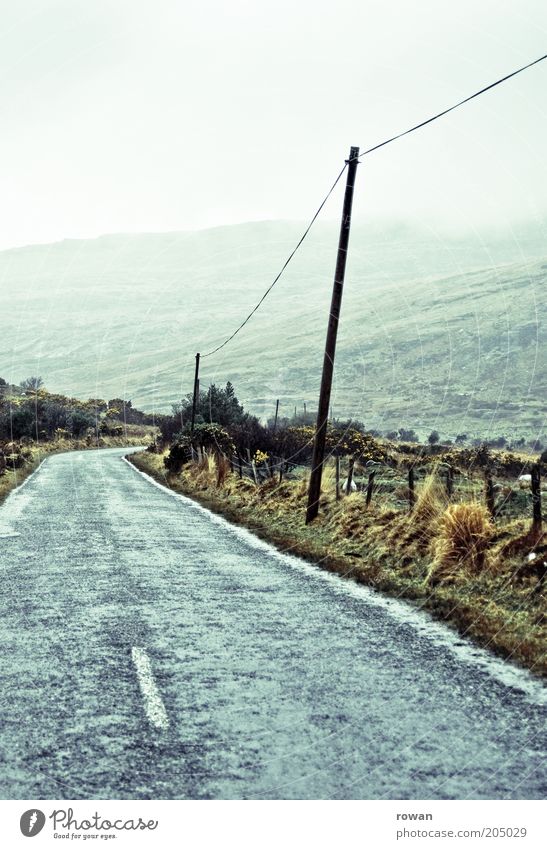 highway Environment Nature Landscape Clouds Bad weather Fog Mountain Vacation & Travel Country road Ireland Electricity pylon Cold Rain Green Mystic In transit