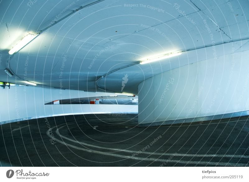 spinning top. Parking garage Transport Street Garage Curve Neon light Subsoil Line Concrete Vacancy Parking lot Subdued colour Interior shot Deserted