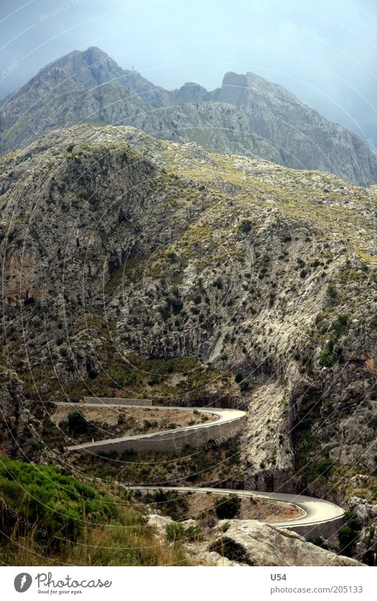 crash barriers Tourism Trip Far-off places Freedom Summer Mountain Landscape Colour photo Exterior shot Day Panorama (View) Peak Winding road Pass