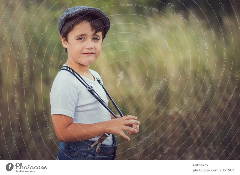 happy kid smiling at camera. Smiling little boy in a meadow in the park. Lifestyle Human being Child Toddler Boy (child) Infancy 1 3 - 8 years Nature Garden