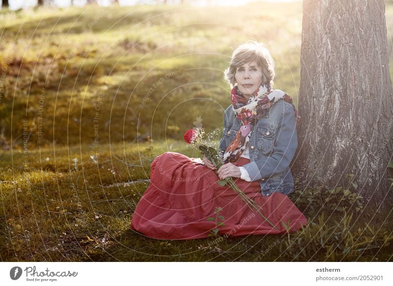 Happy senior woman sitting on the grass Lifestyle Beautiful Wellness Valentine's Day Human being Feminine Female senior Woman Grandmother Senior citizen 1