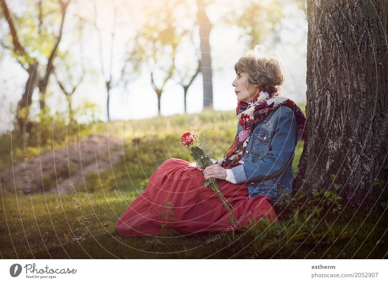 pensive senior woman sitting on the grass Lifestyle Wellness Feasts & Celebrations Valentine's Day Feminine Woman Adults Female senior Grandmother