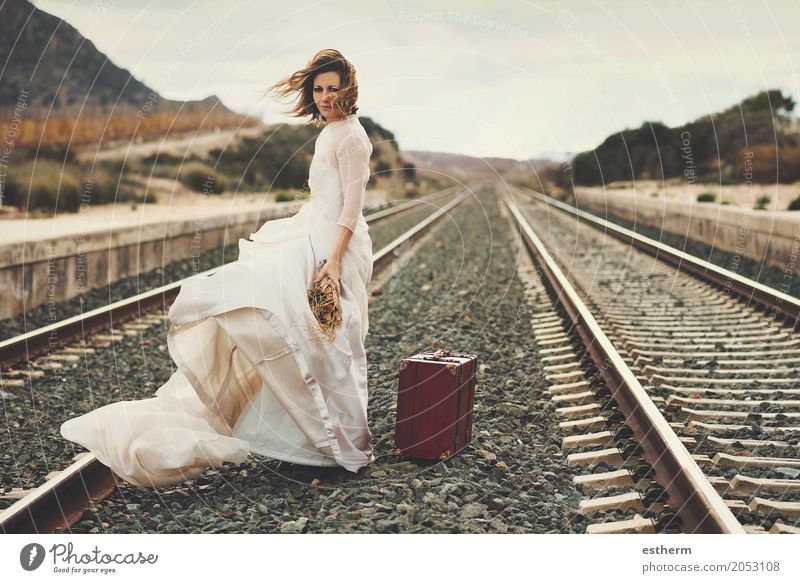 Pensive bride with a red suitcase on the train tracks Lifestyle Elegant Joy Beautiful Wedding Human being Feminine Young woman Youth (Young adults) Couple