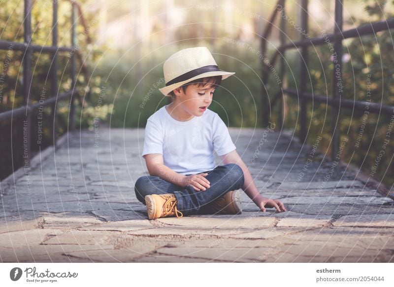 happy child Lifestyle Wellness Human being Child Toddler Boy (child) Infancy 1 3 - 8 years Landscape Spring Garden Field Sit Romp Cuddly Curiosity Emotions Joy