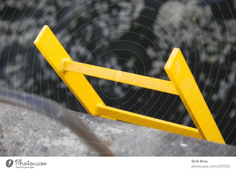 Yellow Saviour Construction site Coast Baltic Sea Ocean Deserted Steel Water Sign Signs and labeling Tall Gray Safety Protection Help Fear Optimism Perspective