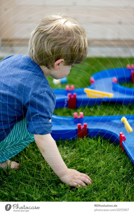 Child playing in the garden Human being Masculine Toddler Boy (child) 1 1 - 3 years Garden Meadow Wood Discover Make Playing Authentic Small naturally Joy