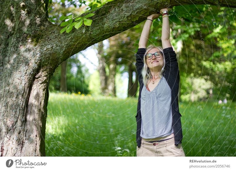 Young woman with dreads standing by a tree portrait Upper body Woman Youth (Young adults) 18 - 30 years Environment Nature Exterior shot Happy Happiness