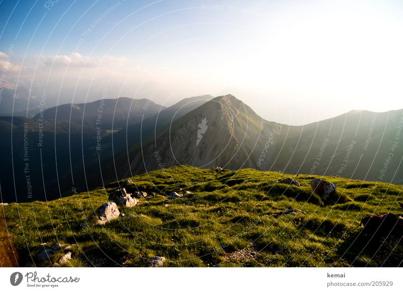 End of a sunny day Environment Nature Landscape Plant Elements Sky Clouds Horizon Sun Sunrise Sunset Sunlight Summer Climate Beautiful weather Warmth Grass Hill