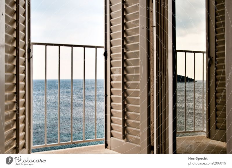 Room with sea view Sky Ocean Balcony Window Shutter Slat blinds Banister Blue Gray White Island Vantage point Calm Horizon Line Colour photo Subdued colour