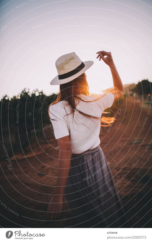 Young adult woman enjoying warm sunset on farmland Lifestyle Joy Happy Relaxation Summer Summer vacation Sun Human being Feminine Young woman