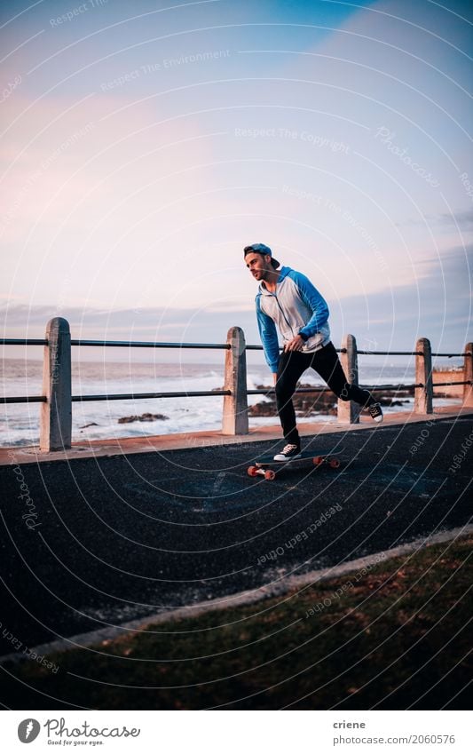 Young adult Man longboarding at promenade Lifestyle Joy Leisure and hobbies Beach Ocean Sports Human being Masculine Adults 1 18 - 30 years Youth (Young adults)