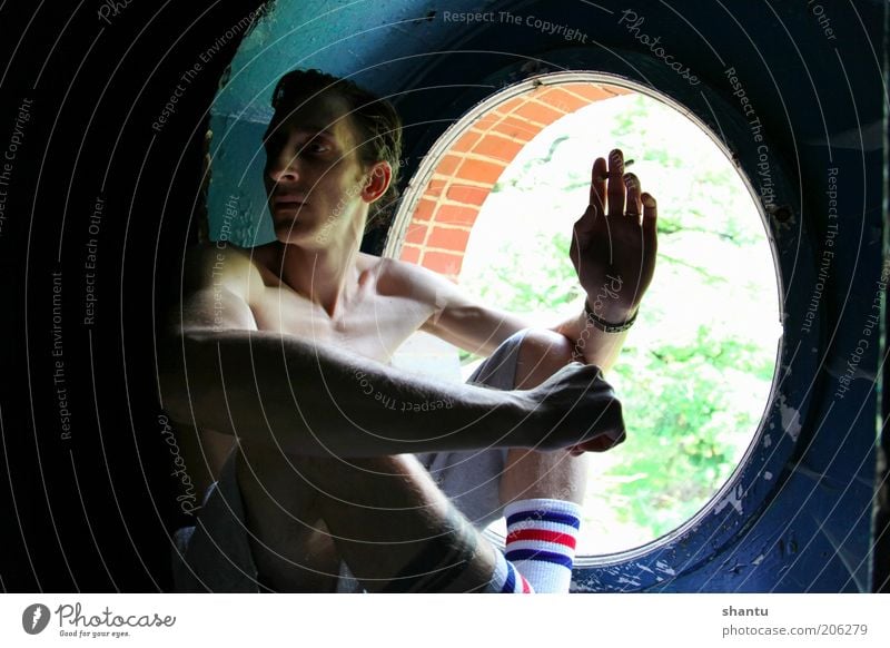 smoking at the window Smoking Man Adults 1 Human being Window Athletic Authentic Moody Colour photo Interior shot Copy Space left Copy Space right