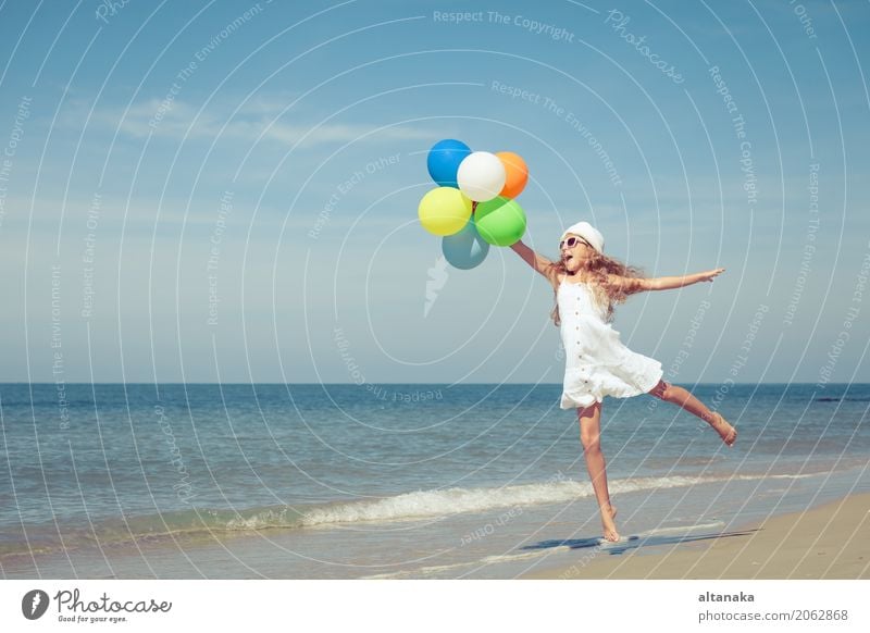 Teen girl with balloons jumping on the beach Lifestyle Joy Happy Relaxation Leisure and hobbies Playing Vacation & Travel Trip Adventure Freedom Summer Sun