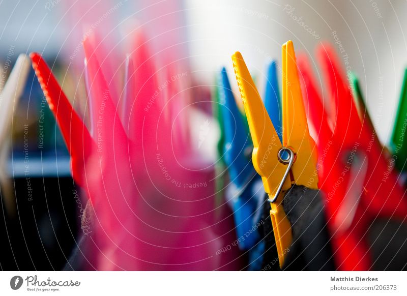 clothespins Clothes peg Macro (Extreme close-up) Clothesline Multicoloured Household Close-up Behind one another Yellow Symbols and metaphors Blur Detail