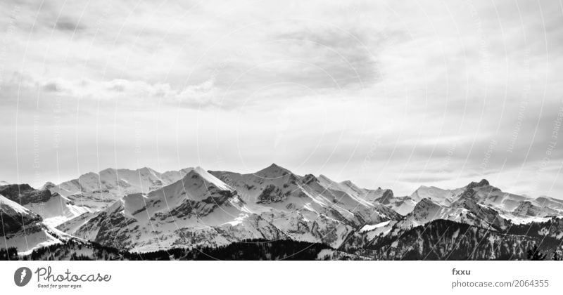 Mountain range in Switzerland Winter Snow Winter vacation Hiking Climbing Mountaineering Nature Landscape Clouds Weather Alps Peak Snowcapped peak Breathe