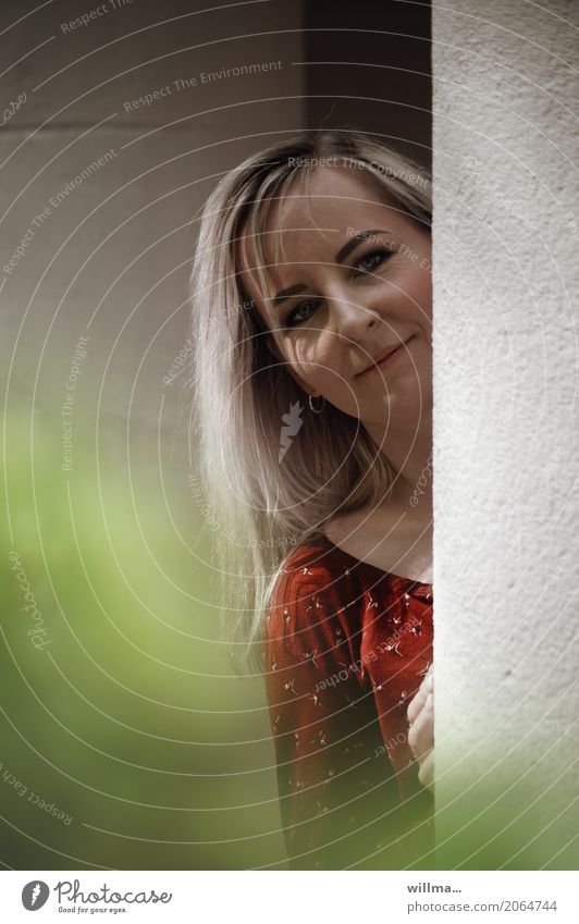 portrait of a blonde young woman looking playfully behind a column Human being Feminine Young woman Youth (Young adults) Woman Adults 1 Wall (barrier)